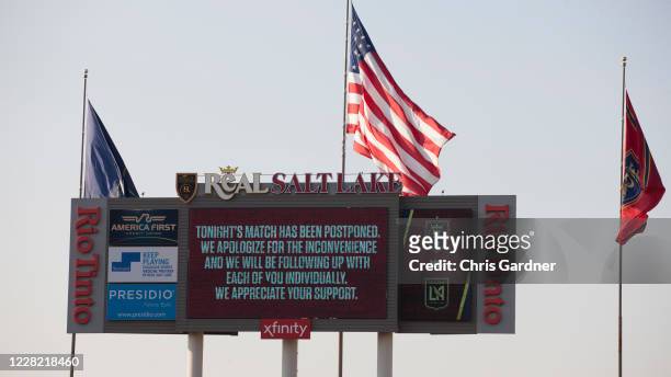 The digital scoreboard flashes an announcement that the game between Real Salt Lake and the Los Angeles FC was postponed at Rio Tinto Stadium on...