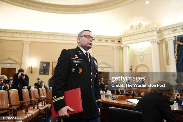National Security Council Europe expert Lt. Col. Alexander S. Vindman leaves after appearing along with aide to Vice President Mike Pence, Jennifer...