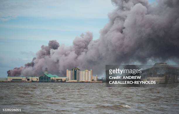 Smoke rises from a burning chemical plant after the passing of Hurricane Laura in Lake Charles, Louisiana on August 27, 2020. - Hurricane Laura...