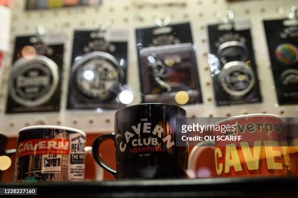 Beatles merchandise is displayed for sale in the Cavern Club as it reopens to the public with live music to host their annual 'Beatleweek'...