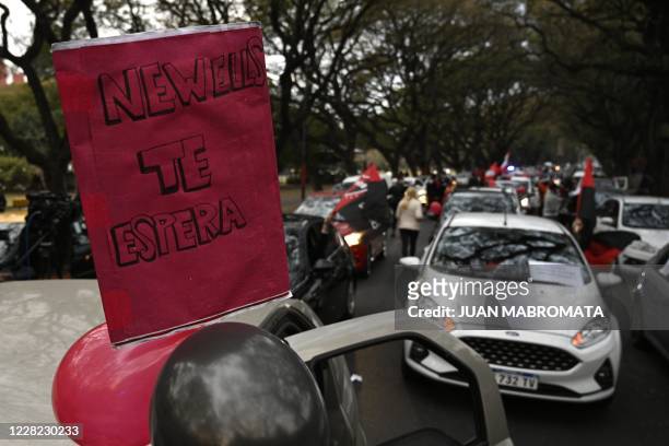 Argentina's Newells Old Boys supporters gather outside the Marcelo Bielsa stadium before a convoy requesting Argentine footballer Lionel Messi to...