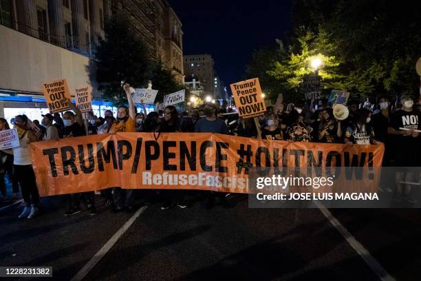 Demonstrators march outside the White House during a rally to protest US President Donald Trump's acceptance of the Republican National Convention...