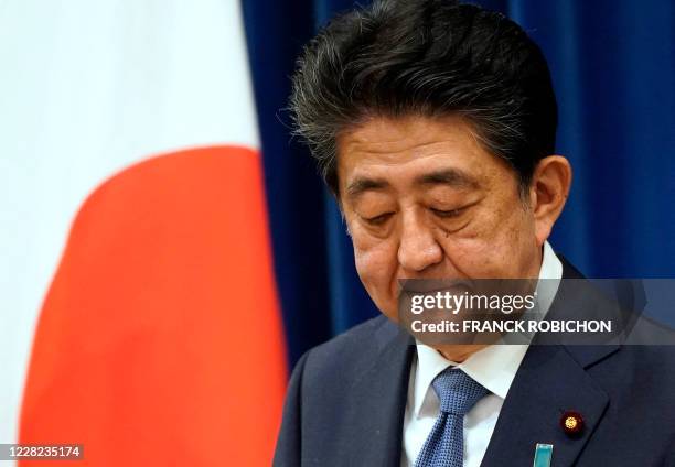 Japanese Prime Minister Shinzo Abe gestures during his press conference at the prime minister official residence in Tokyo on August 28, 2020. -...