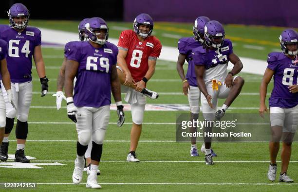 The Minnesota Vikings offense warms up during training camp on August 28, 2020 at U.S. Bank Stadium in Minneapolis, Minnesota.