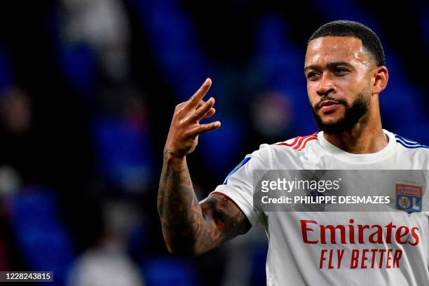 Lyon's Dutch forward Memphis Depay celebrates after scoring a goal during the French L1 footall match between Olympique Lyonnais and Dijon FC on...
