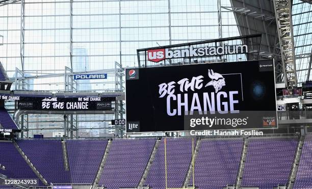 Be The Change is seen on the video board at U.S. Bank Stadium as players address the media regarding police violence and race inequalities during...