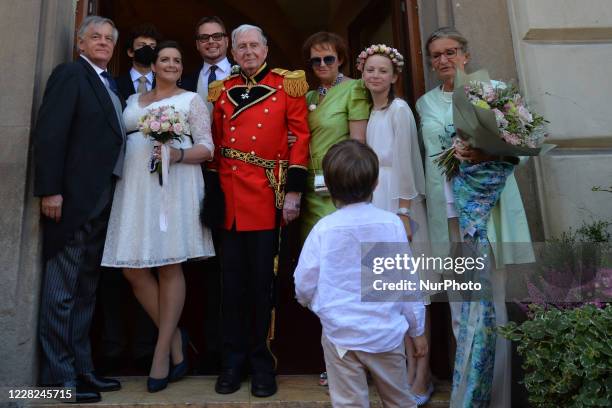 Prince Jan Lubomirski-Lanckoronski and Countess Helena Mankowska, pose for a photo with a handful of closest relatives after their wedding ceremony,...