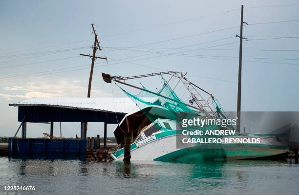 Destroyed shrimping boat is seen after the passing of hurricane Laura in Hackberry, Louisiana on August 28, 2020. - At least six people were killed...