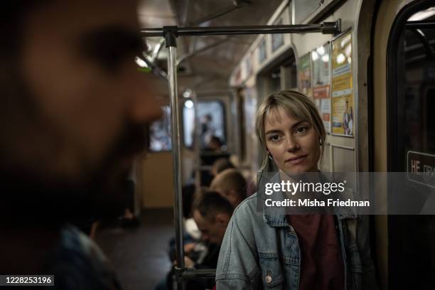 Natasha looks at Andrei on their way to an anti-government Women's March on August 29, 2020 in Minsk, Belarus. There have been daily protests since...