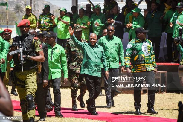 Tanzania's incumbent President and presidential candidate of ruling party Chama Cha Mapinduzi John Magufuli waves as he arrives to give a speech...