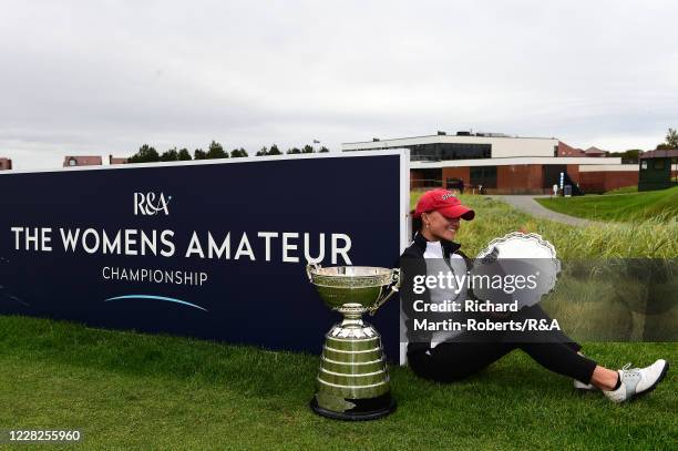 Aline Krauter of Germany looks at the trophy following her victory during the Final on Day Five of The Women's Amateur Championship at The West...