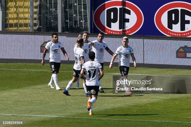 Esteban Paredes of Colo-Colo celebrates with teammates after scoring the first goal of his team during a match between Colo-Colo and Santiago...