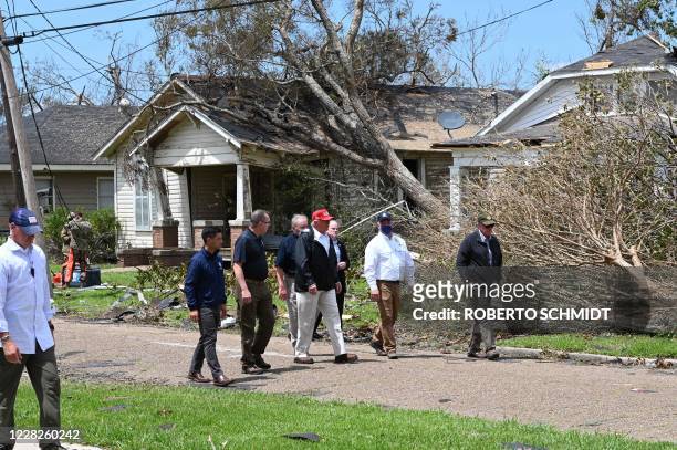 President Donald Trump tours the damage caused by Hurricane Laura, in Lake Charles, Louisiana, on August 29, 2020. - At least 15 people were killed...