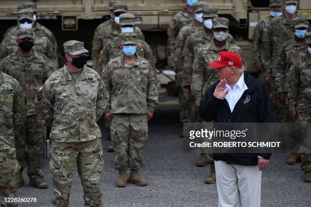 President Donald Trump joins National Guard troops in Lake Charles, Louisiana, on August 29, 2020. Trump surveyed damage in the area caused by...