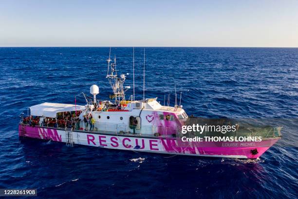 The rescue ship funded by British street artist Banksy "Louise Michel" is pictured during a rescue operation by crew members of civil sea rescue ship...