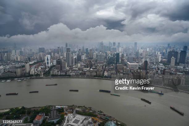 Boats navigate the Huangpu River as seen from the Oriental Pearl Television Tower in the Pudong district on August 29, 2020 in Shanghai, China.