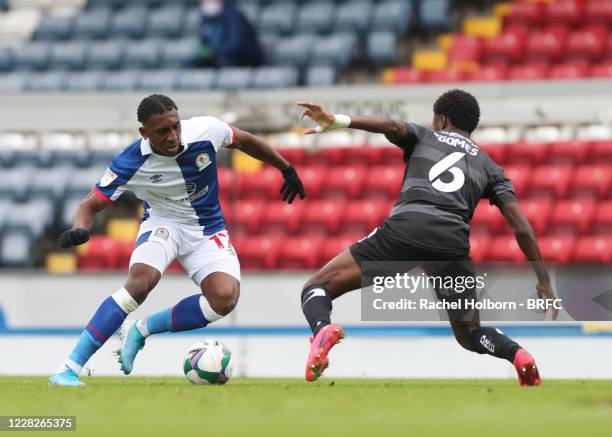 Amarii Bell of Blackburn Rovers and Madger Gomes of Doncaster Rovers during the Carabao Cup First Round match between Blackburn Rovers and Doncaster...