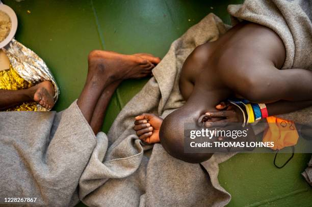 Migrants wait onboard the Sea-Watch 4 civil sea rescue ship, that is waiting for permission to run into a port, on sea between Malta and Italy, on...