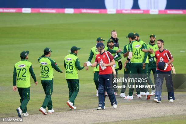 Players shake hands at the end of the international Twenty20 cricket match between England and Pakistan at Old Trafford cricket ground in Manchester,...