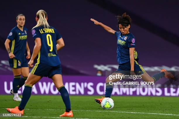 Lyon's Japanese midfielder Saki Kumagai shoots and scores a goal during the UEFA Women's Champions League final football match between VfL Wolfsburg...