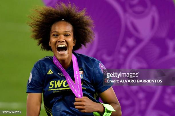 Lyon's French defender Wendie Renard celebrates winning the UEFA Women's Champions League final football match between VfL Wolfsburg and Lyon at the...