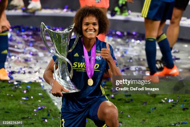 Wendie Renard of Olympique Lyon celebrate with the UEFA Women's Champions League Trophy following their team's victory in the UEFA Women's Champions...