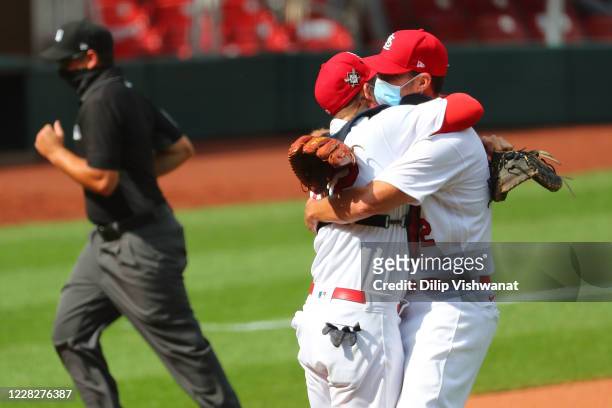 Adam Wainwright of the St. Louis Cardinals is congratulated by Yadier Molina of the St. Louis Cardinals after throwing a complete game against the...