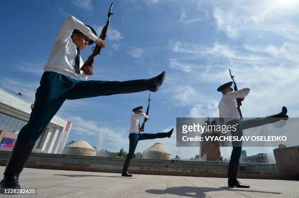 Kyrgyz honour guards march during the changing of the guards ceremony during the celebrations marking the 29th anniversary of Kyrgyzstan's...