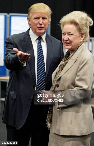 Property tycoon Donald Trump is pictured with his sister Maryanne Trump Barry as they adjourn for lunch during a public inquiry over his plans to...