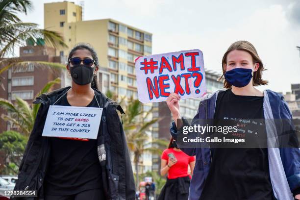 Participants march from Durban beachfront to Durban City Hall during the #EndTheFemicide protest on August 29, 2020 in Durban, South Africa. It is...