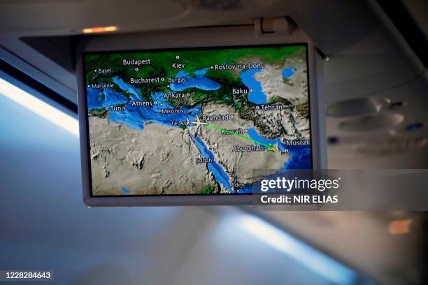 Screen displays a map showing the flight route of Israeli carrier El Al from Israel to Abu Dhabi, on August 31, 2020. - A US-Israeli delegation...