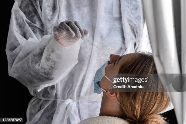 Nurses and doctors perform PCR tests in the laboratory installed in front of the Paris City Hall against the spread of the novel Coronavirus on...