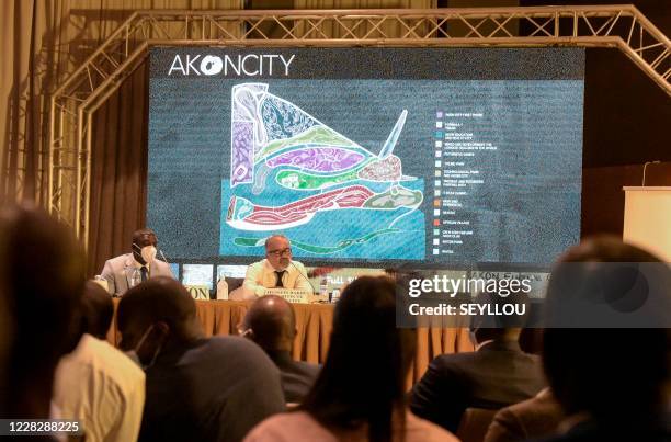 Senegalese-American singer and songwriter Akon speaks to the press in a hotel in Dakar, on August 31 to present plans to create a city named "Akon...