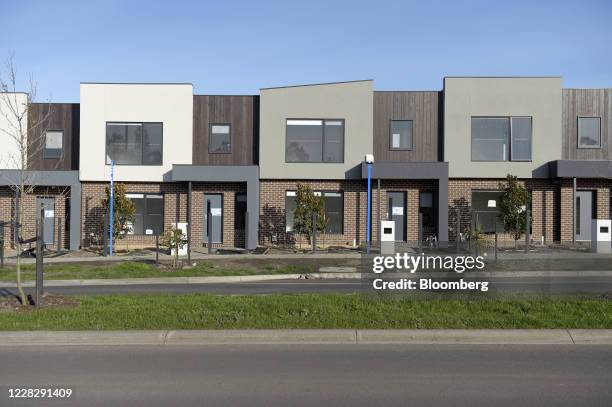 Row of newly constructed town houses stand at a housing development in Melbourne, Australia, on Tuesday, Sept. 1, 2020. Australian house prices fell...