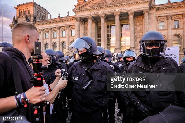 German riot police clears protesters outside the Reichstag during a ...