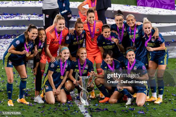 The players of Olympique Lyon celebrate with the trophy after the victory of their team during the UEFA Women's Champions League Final between VfL...