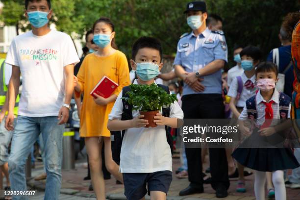 Pupils enter the campus.Wuhan City, Hubei Province, China, September 1, 202-