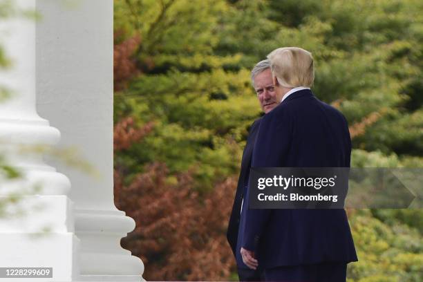 President Donald Trump speaks with Mark Meadows, White House chief of staff, while departing the White House in Washington, D.C., U.S., on Tuesday,...