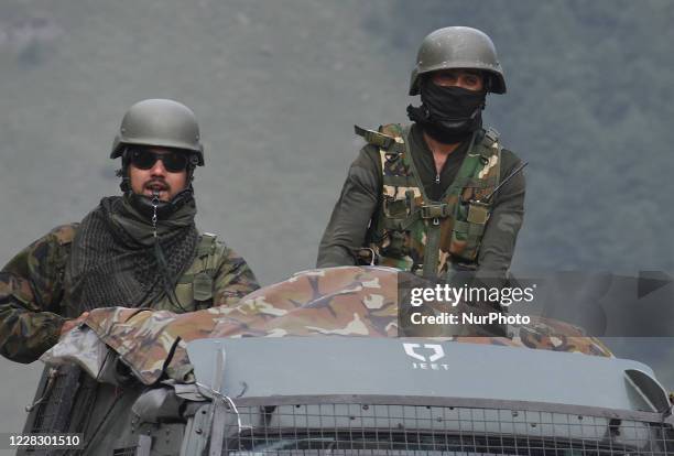 Indian army soldiers on top of a military vehicle crossing the Srinagar-Leh National highway on September 01, 2020.In a further escalation of...