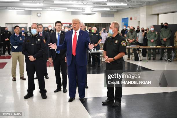 President Donald Trump speaks with officials on September 1 at Mary D. Bradford High School in Kenosha, Wisconsin. - Trump visited Kenosha, the city...