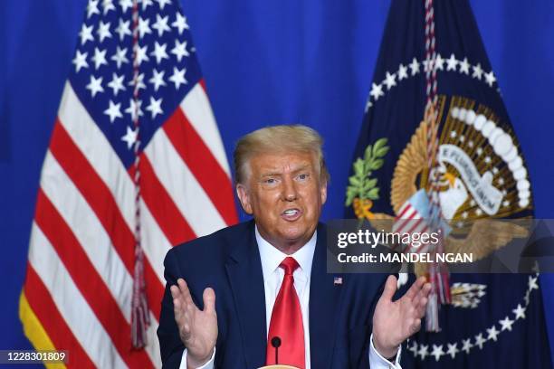 President Donald Trump speaks to officials during a roundtable discussion on community safety, at Mary D. Bradford High School in in Kenosha,...
