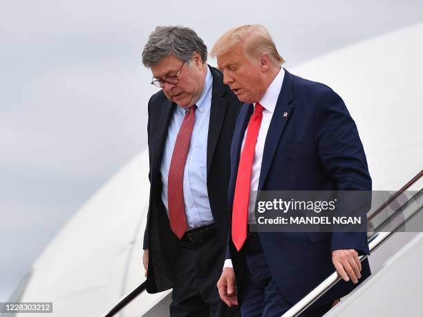 President Donald Trump and US Attorney General William Barr step off Air Force One upon arrival at Andrews Air Force Base in Maryland on September 1,...