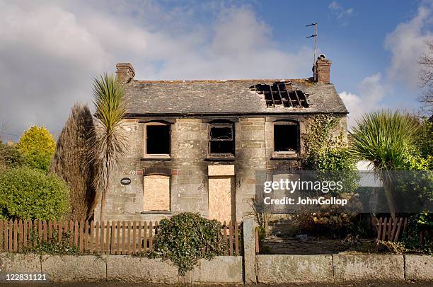 burnt cottage - damaged roof stock pictures, royalty-free photos & images