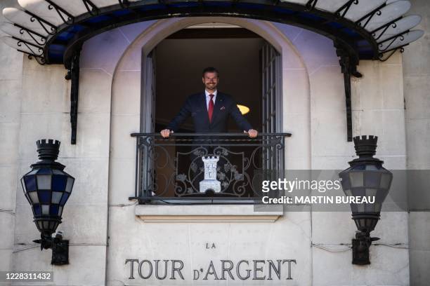 Paris restaurant La Tour d'Argent's director Andre Terrail poses from a restaurant's window in central Paris on September 2, 2020.