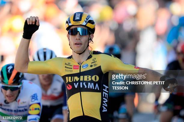 Team Jumbo rider Belgium's Wout van Aert celebrates as he crosses the finish line to win the 5th stage of the 107th edition of the Tour de France...