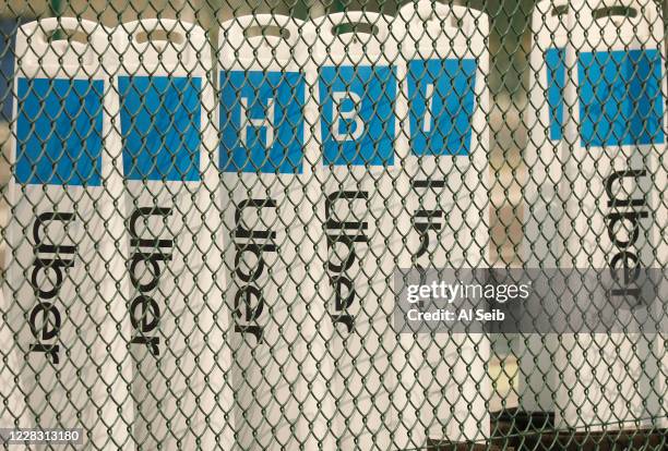 Uber signage at the Rideshare Lot at LAX as Uber and Lyft drivers held a moving rally as part of a statewide day of action to demand that both...