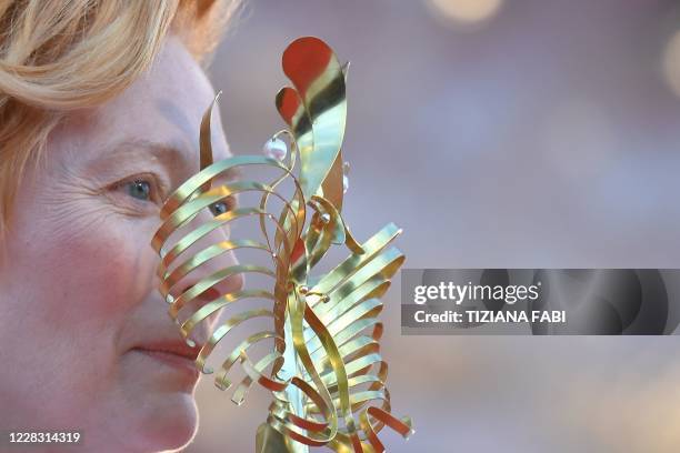 British actress Tilda Swinton arrives for the opening ceremony and the screening of the film "Lacci" on the opening day of the 77th Venice Film...