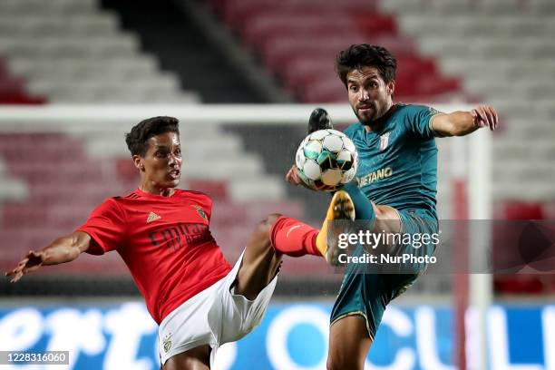 Nico Gaitan of SC Braga vies with Pedrinho of SL Benfica during the pre season friendly football match between SL Benfica and SC Braga at the Luz...