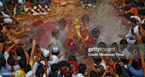 Devotees during immersion of Mumbai Cha Raja at Ganesh Galli in artificial pond on Anant Chaturdashi during Covid-19 pandemic on September 1, 2020 in...