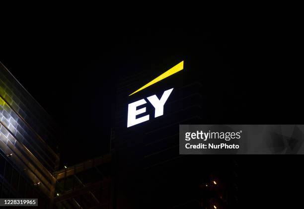 Ernst &amp; Young logo is seen on top of the Rondo 1 office skyscraper on September 2, 2020 in Warsaw, Poland.